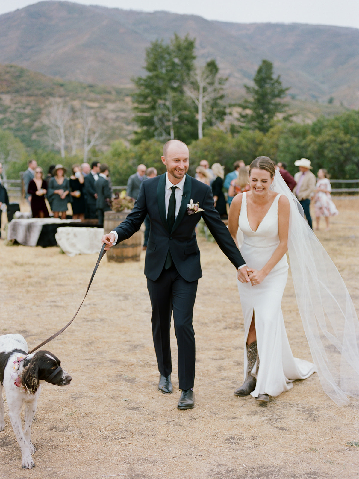 a rustic modern wedding in the high mountains of Utah. The bride is a caucasian female wearing a white crepe fabric wedding dress.