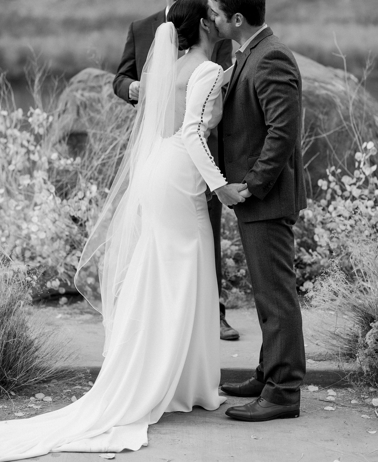 bride and groom exchange vows at their intimate destination wedding in moab utah