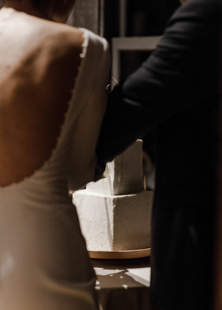 couple cutting their simple wedding cake