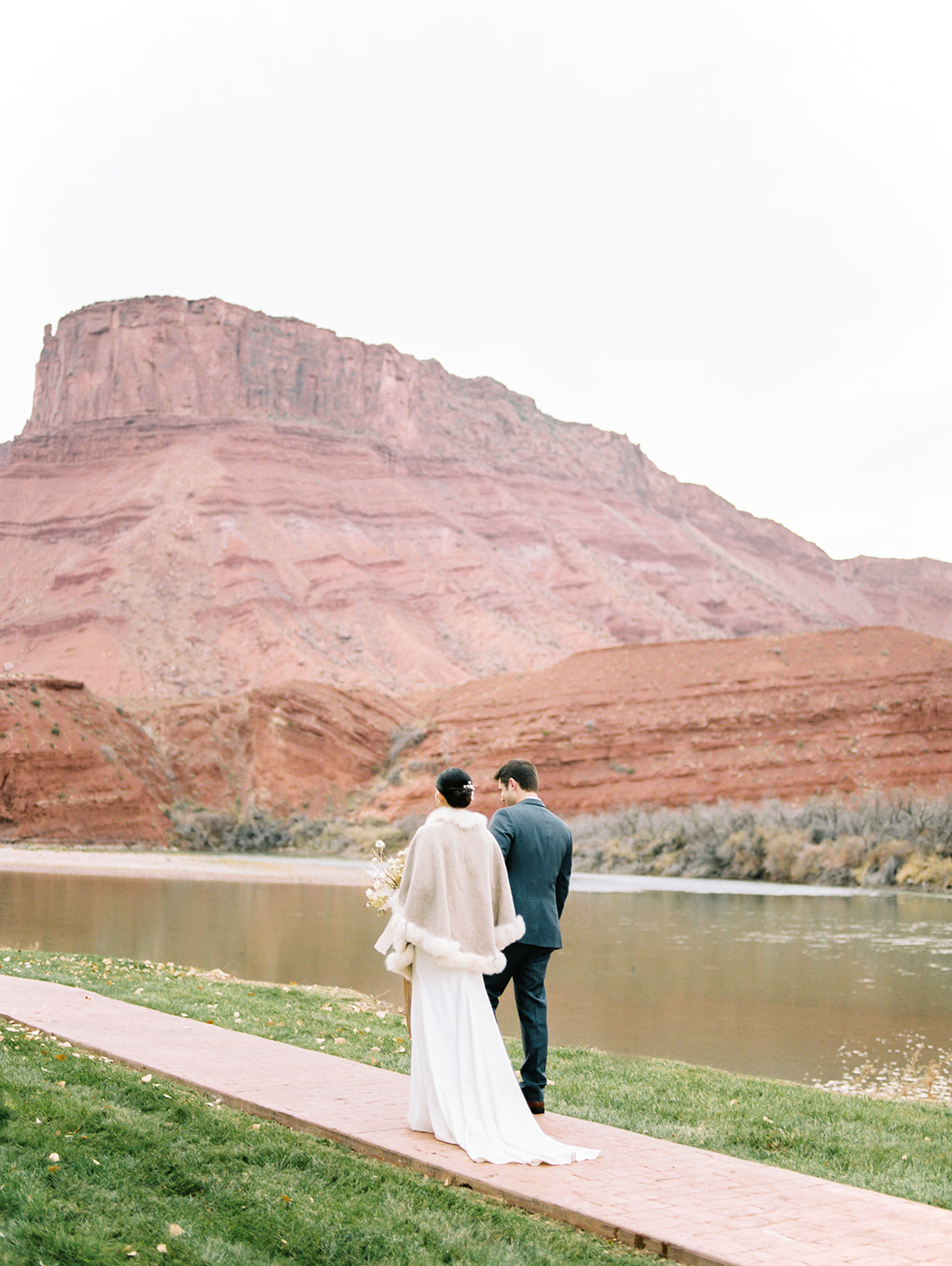 bride and groom portraits along the colorado river at their moab utah destination wedding