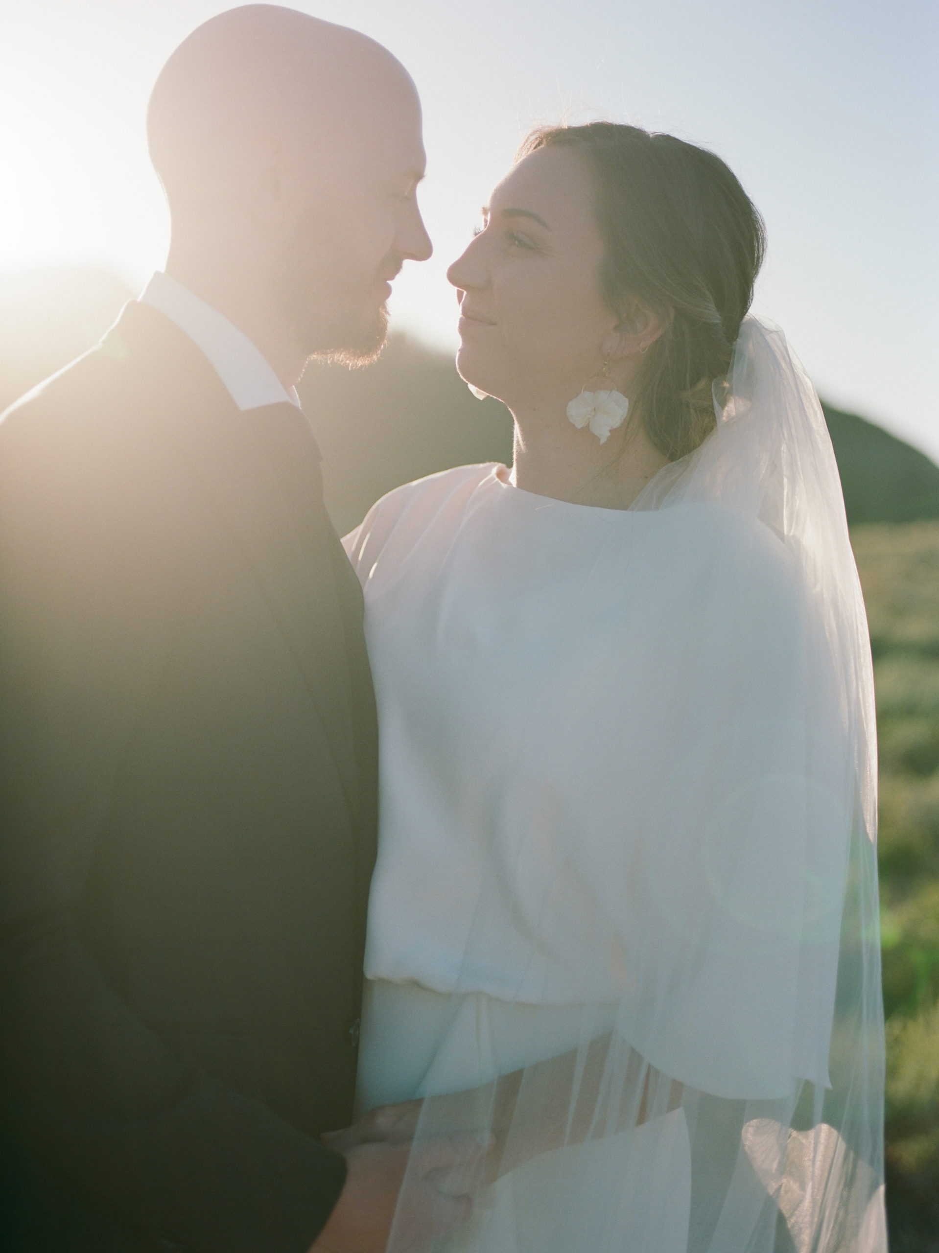mountain top bride and groom portraits at sunset