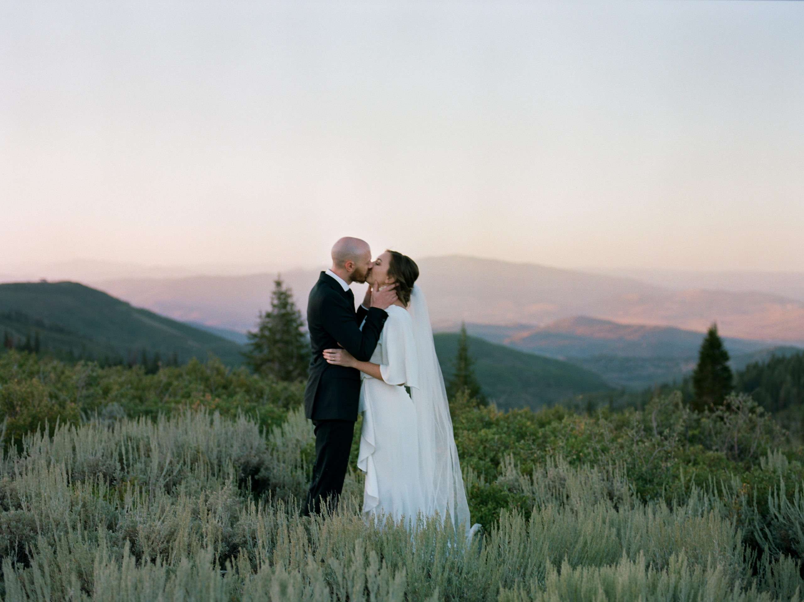 bride and groom portraits on mountain in Utah