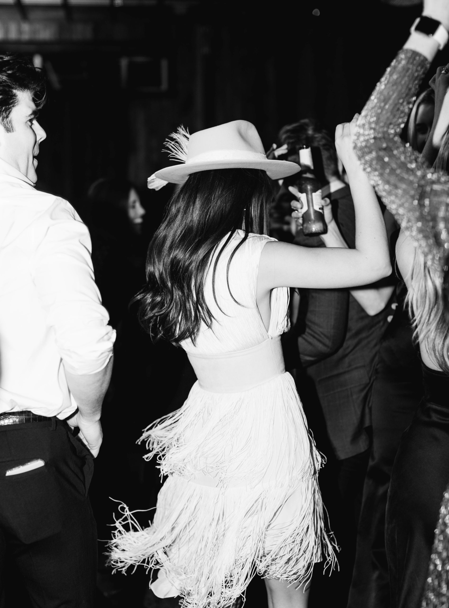 a bride and her guests dance at a wedding reception at blue sky ranch in utah. photo by megan robinson photography