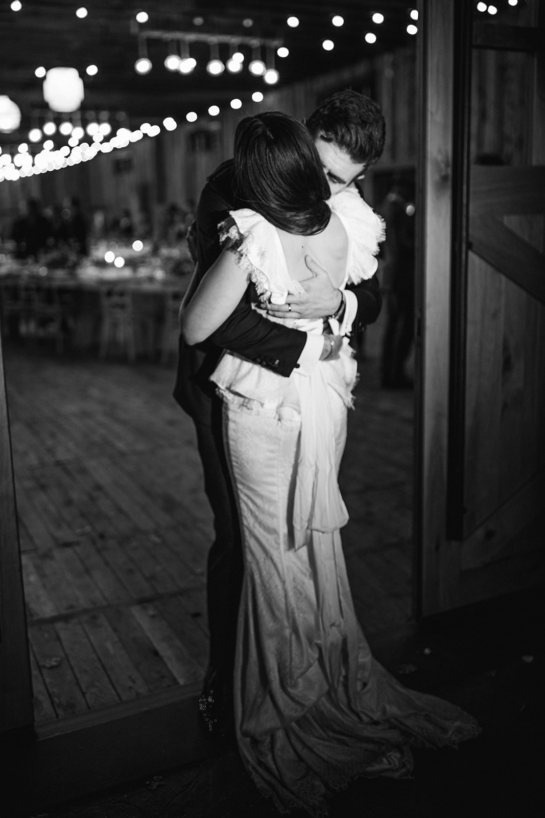 a bride and groom hug during their wedding reception at the lodge at blue sky in wanship utah. photo by megan robinson photography