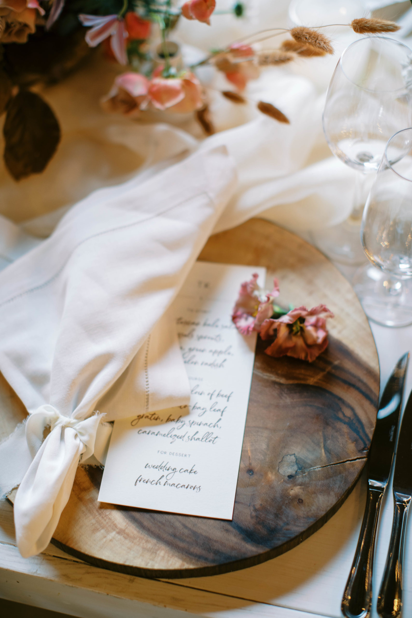 wedding table place setting with a custom menu and wooden charger for an eclectic utah ranch wedding. photo by megan robinson photography