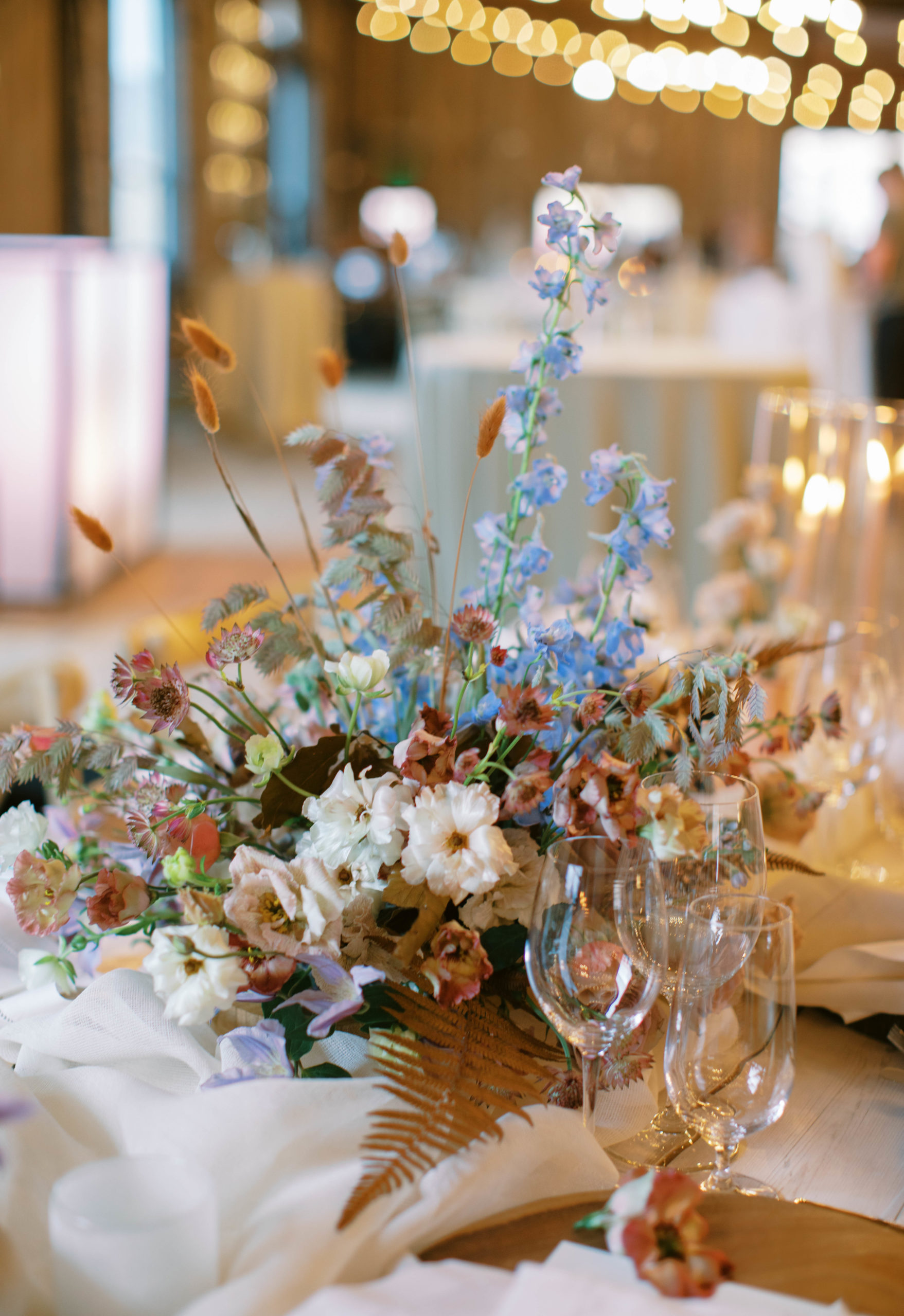 eclectic wildflower wedding centerpieces at this unique utah ranch wedding. photo by megan robinson photography