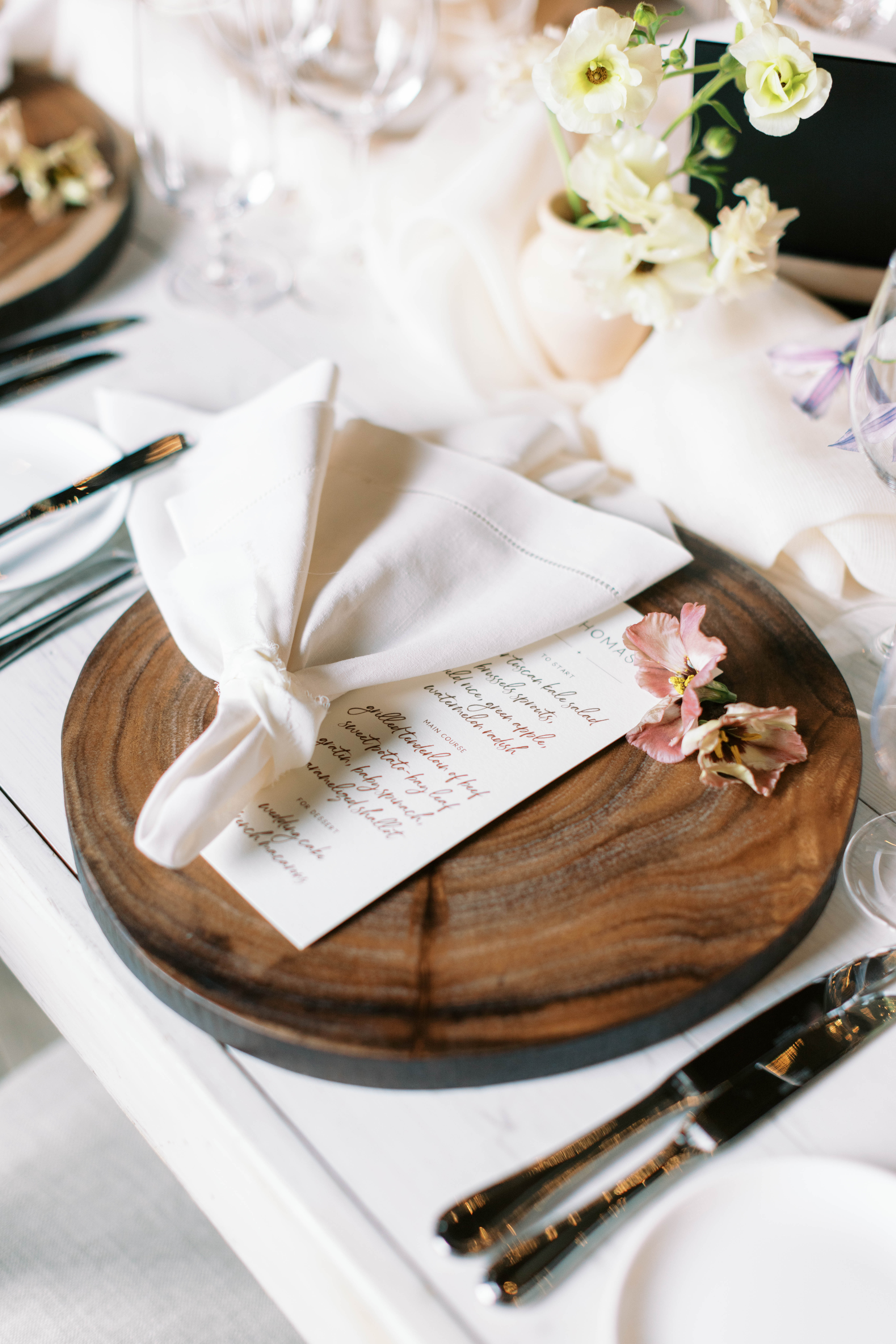 wedding table place setting with a custom menu and wooden charger for an eclectic utah ranch wedding. photo by megan robinson photography