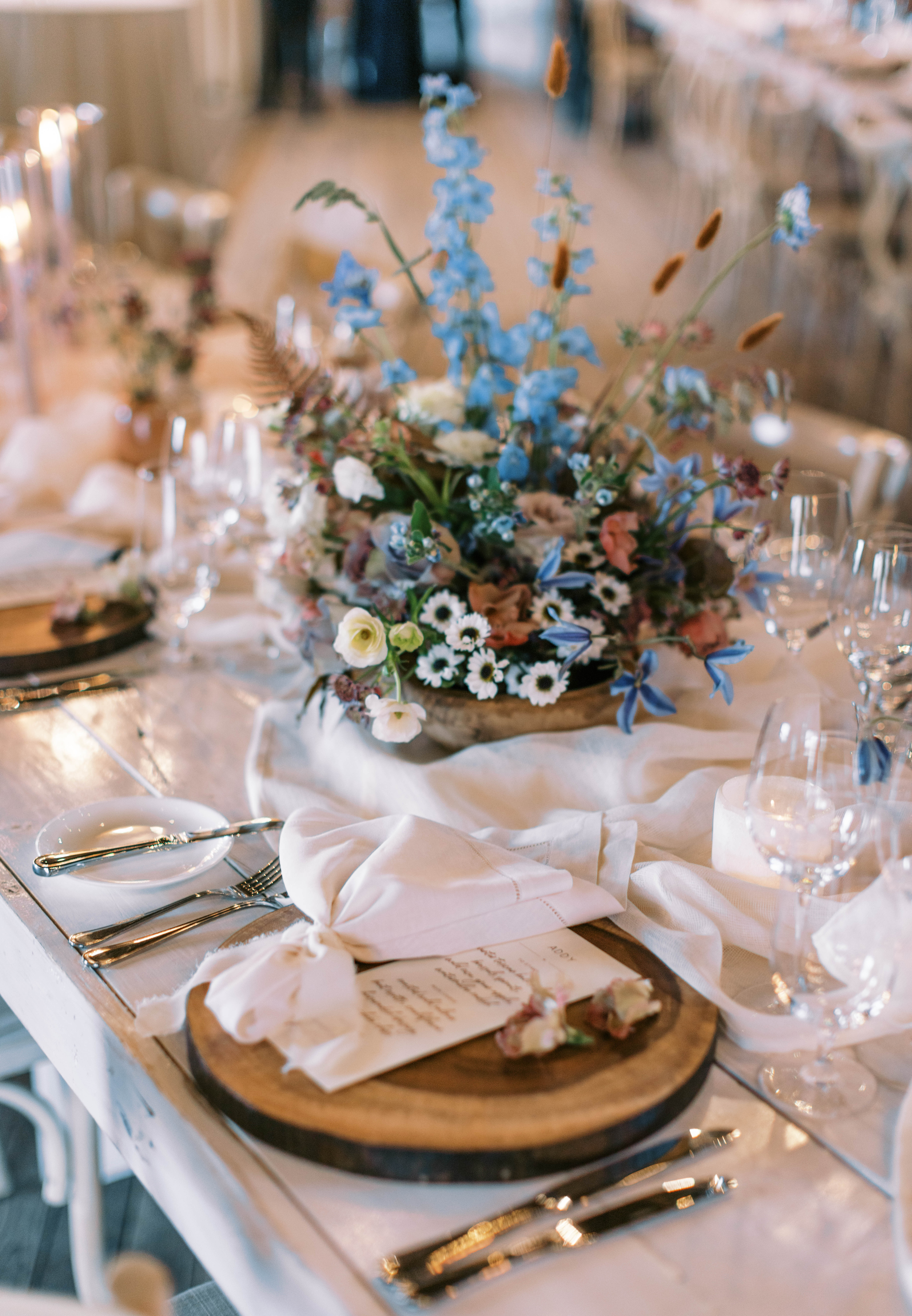 eclectic wildflower wedding centerpieces at this unique utah ranch wedding. photo by megan robinson photography