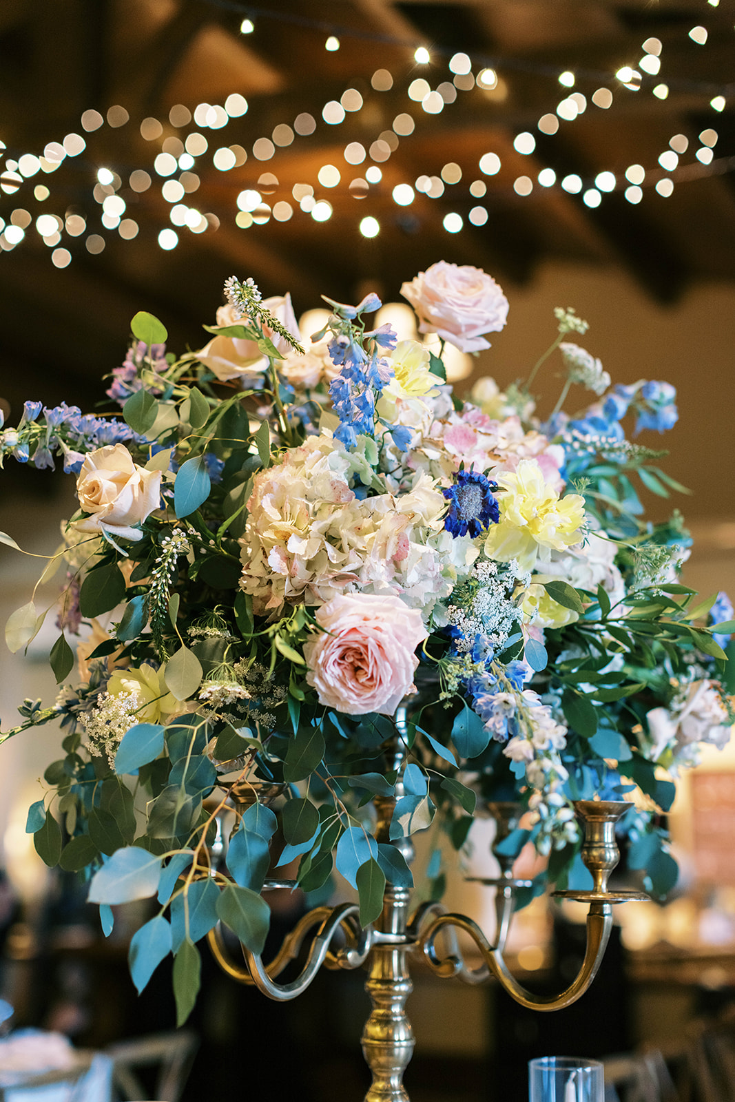 garden theme wedding flower centerpieces filled with roses for a garden party montage deer valley resort wedding in park city utah. photo by megan robinson photography