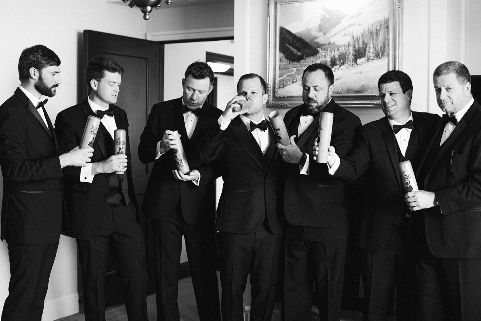 groomsmen wearing black groomsmen tuxedos have a beer together before the groom's wedding ceremony at montage deer valley resort. photo by megan robinson photography