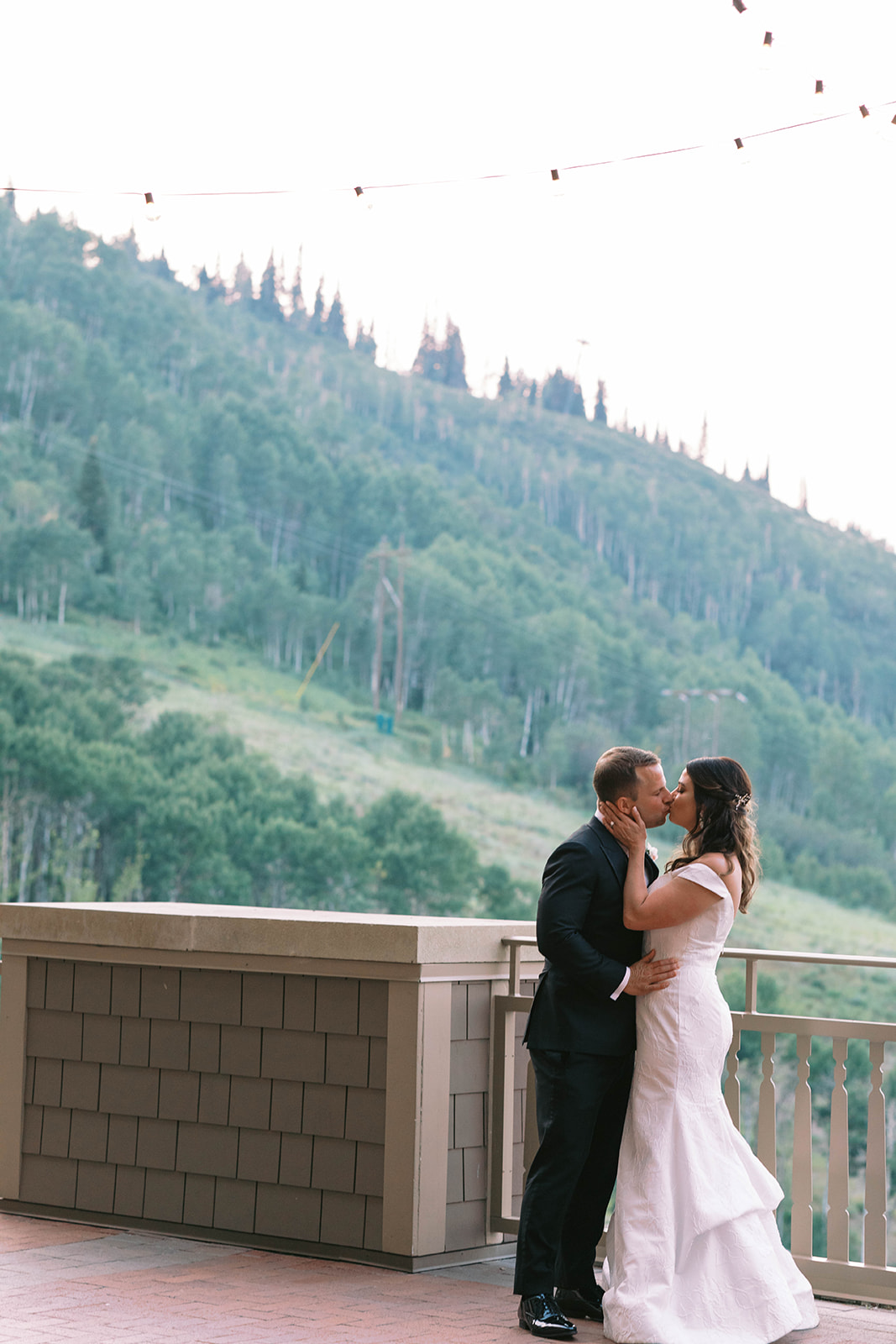 bride and groom kiss at their mountain garden themed wedding at montage deer valley in utah. photo taken by megan robinson photography