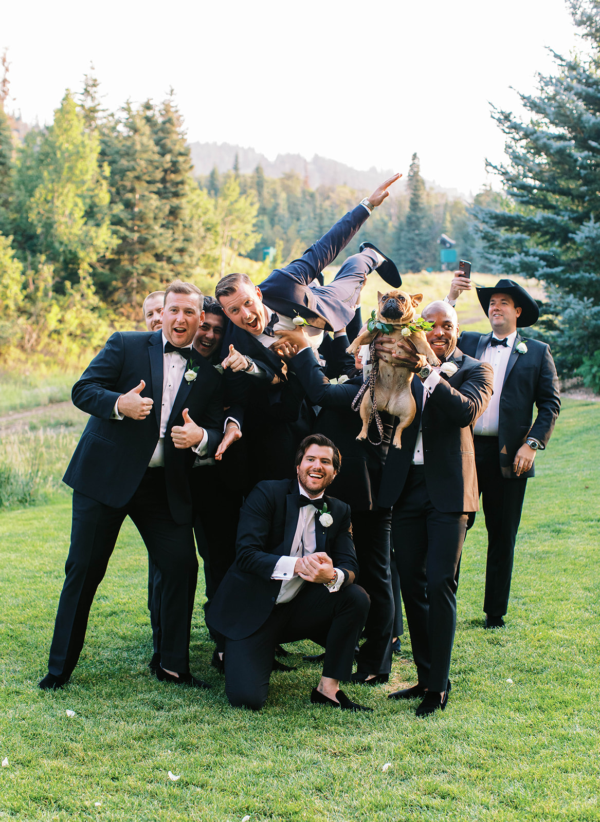 a groom and his groomsmen pose for photos at st regis deer valley on his wedding day 